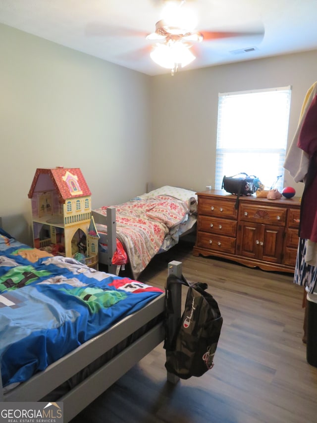 bedroom featuring ceiling fan and light hardwood / wood-style flooring