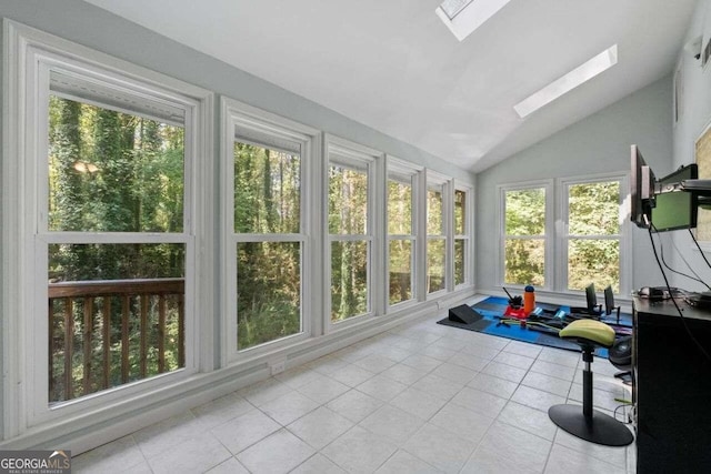 sunroom / solarium with vaulted ceiling with skylight and a healthy amount of sunlight