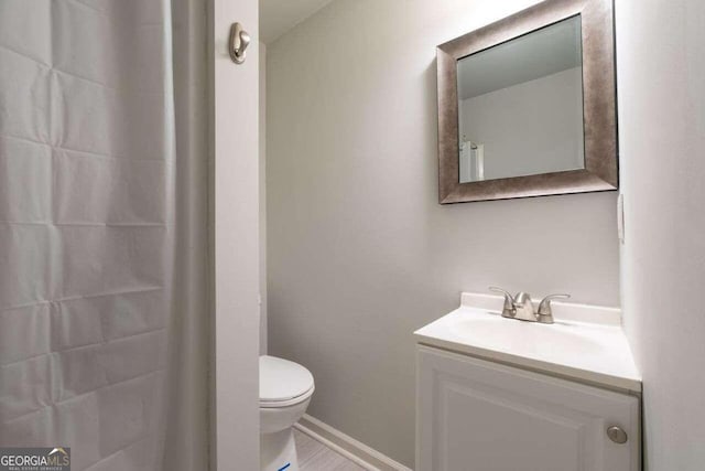 bathroom with vanity and toilet