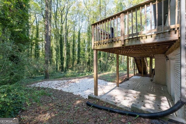 view of yard with a wooden deck