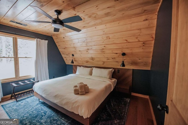 bedroom featuring wood-type flooring, wood ceiling, vaulted ceiling, and ceiling fan