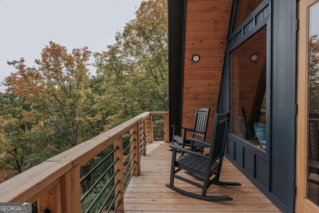 wooden balcony featuring a deck