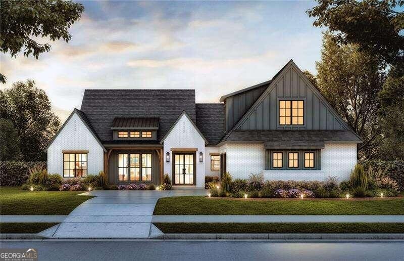 modern inspired farmhouse featuring board and batten siding, a yard, french doors, and roof with shingles