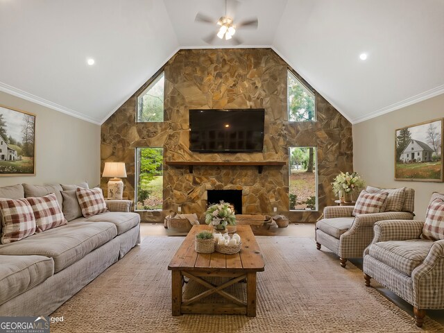 living room featuring ceiling fan, a fireplace, plenty of natural light, and ornamental molding