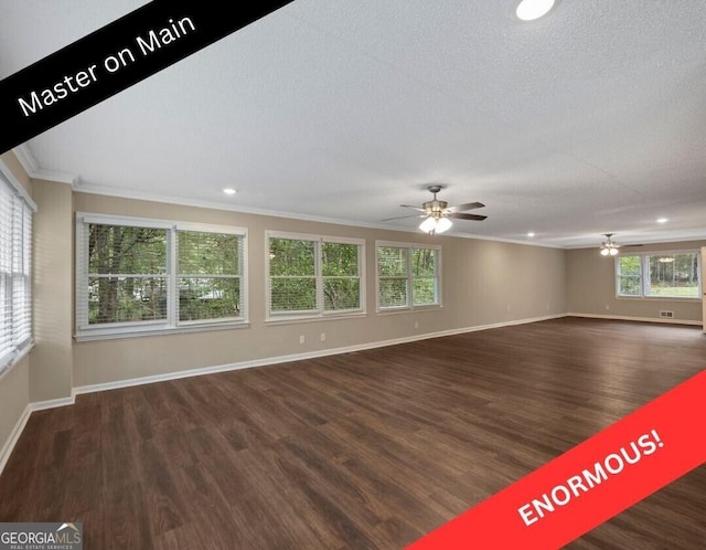 unfurnished room featuring a textured ceiling, dark wood-type flooring, ornamental molding, and ceiling fan