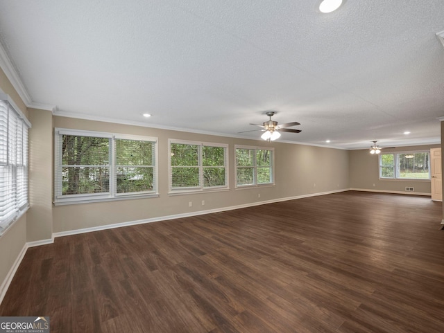 unfurnished room with ceiling fan, dark wood-type flooring, a textured ceiling, and ornamental molding