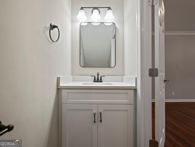 bathroom with hardwood / wood-style flooring and vanity