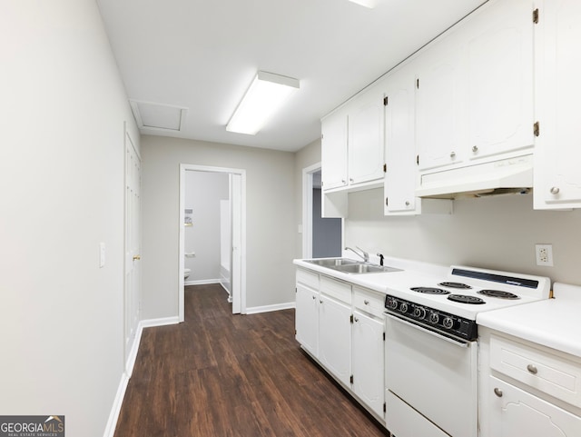 kitchen with electric stove, white cabinetry, and sink