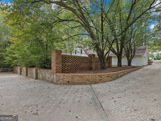 view of side of home featuring a garage