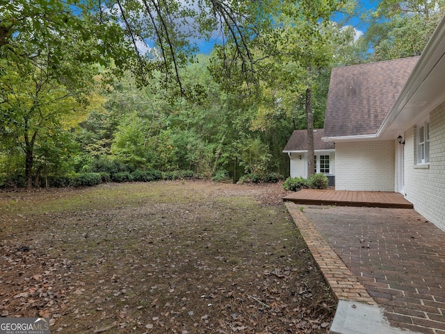 view of yard featuring a deck