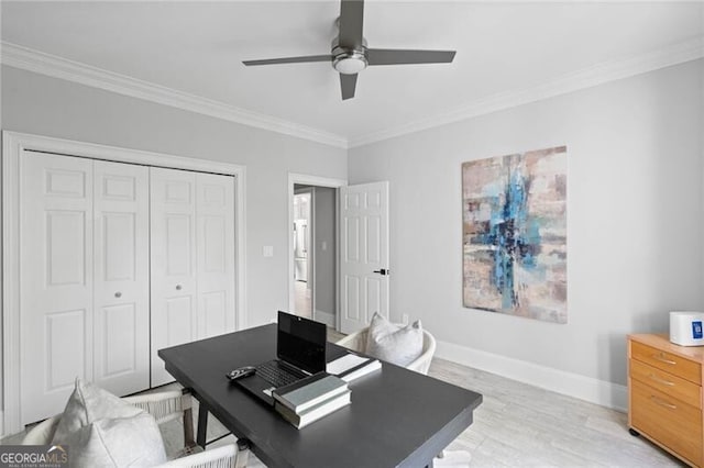 home office with ornamental molding, ceiling fan, and light hardwood / wood-style floors