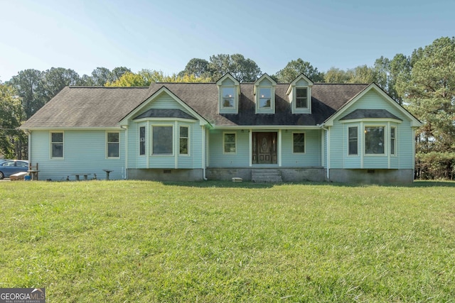 rear view of property with a yard