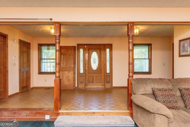 entryway featuring a textured ceiling