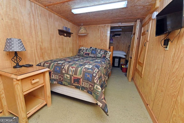 bedroom with wooden walls