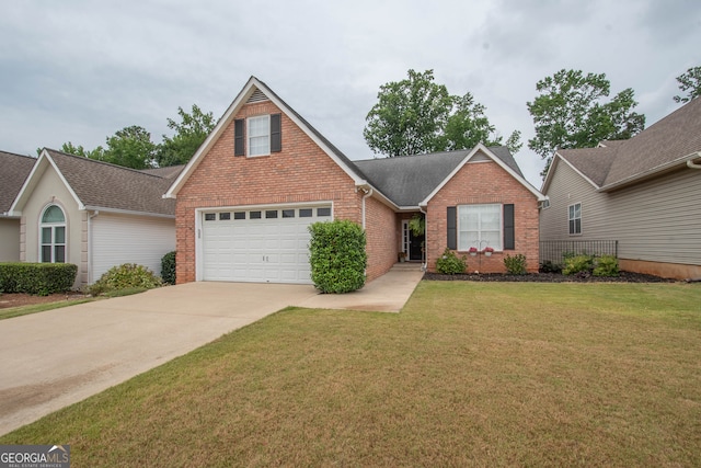 view of front of house with a garage and a front yard