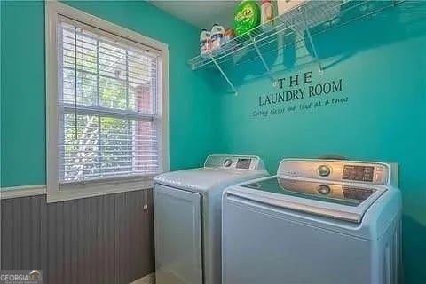 washroom with separate washer and dryer