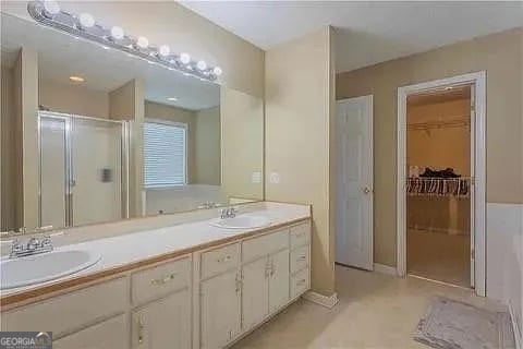 bathroom featuring vanity and walk in shower