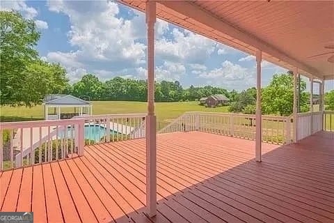 wooden terrace with a gazebo