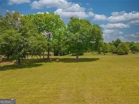 surrounding community featuring a lawn