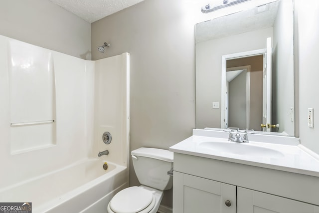 full bathroom with vanity, shower / bath combination, toilet, and a textured ceiling