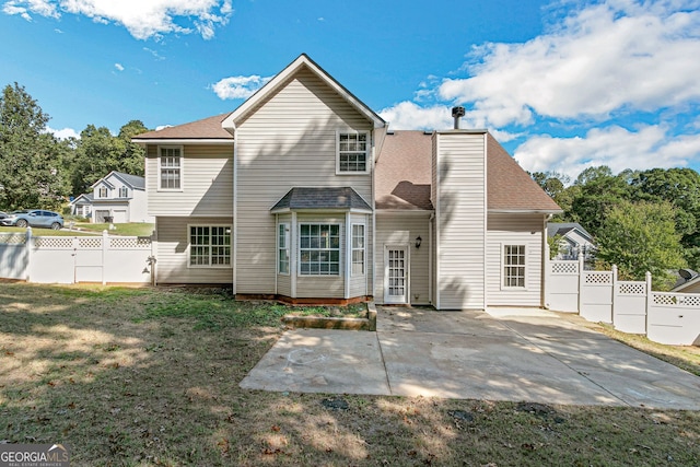 back of property featuring a patio area