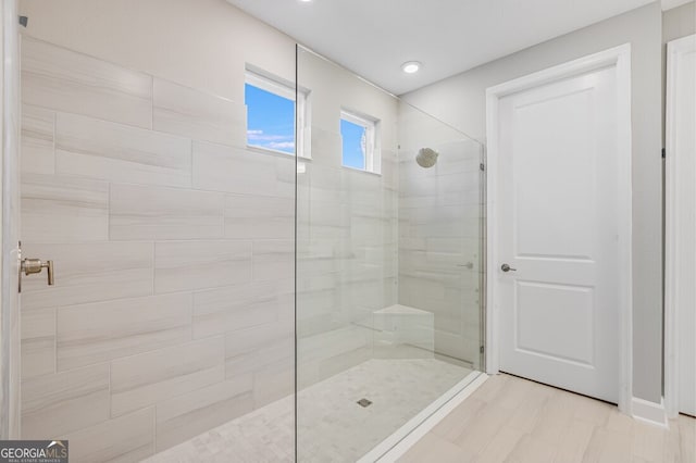 bathroom with a tile shower