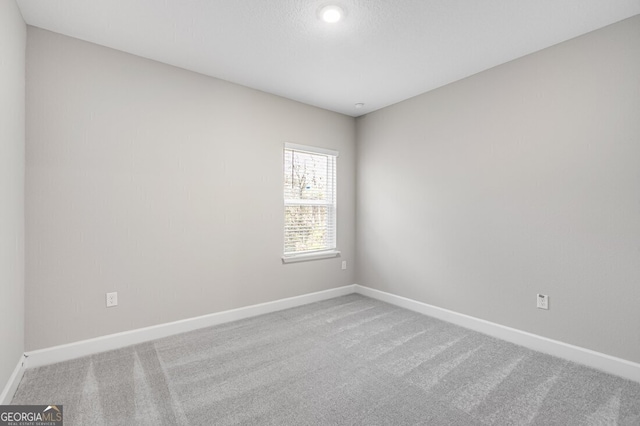 empty room featuring carpet flooring