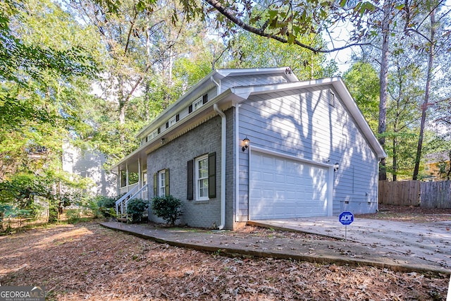 view of property exterior featuring a garage