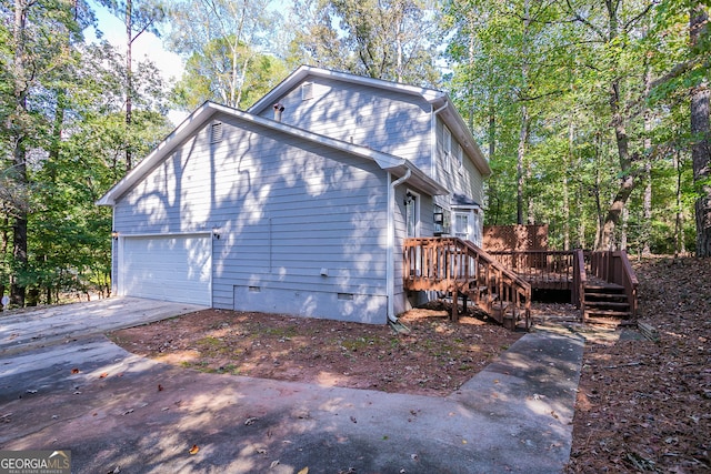 view of side of home featuring a wooden deck