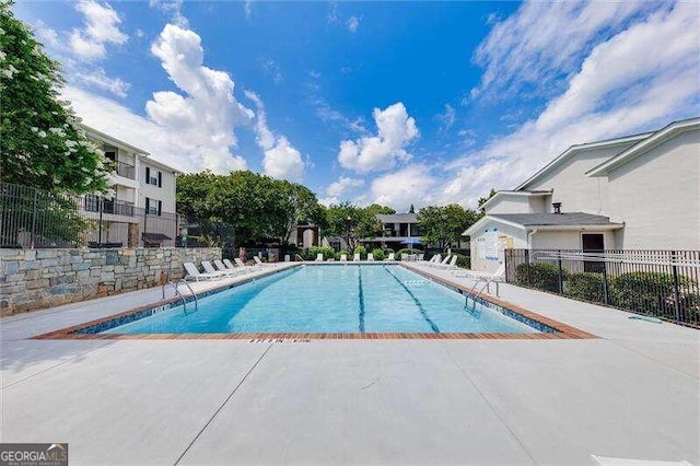 view of pool featuring a patio