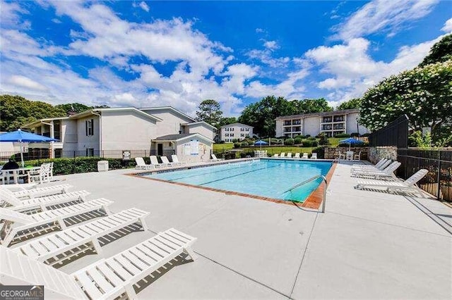 view of swimming pool with a patio area