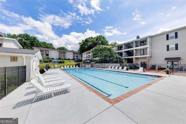 view of pool featuring a patio