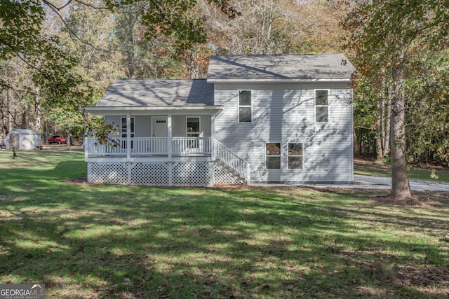 tri-level home with a shed, a front yard, and a porch