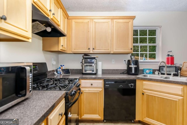 kitchen featuring light brown cabinetry, black appliances, sink, and a textured ceiling