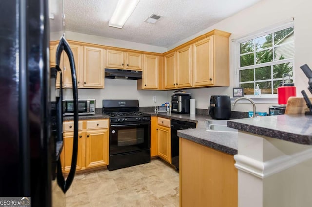 kitchen with kitchen peninsula, black appliances, sink, and a textured ceiling