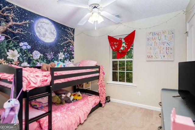 bedroom featuring carpet, a textured ceiling, and ceiling fan