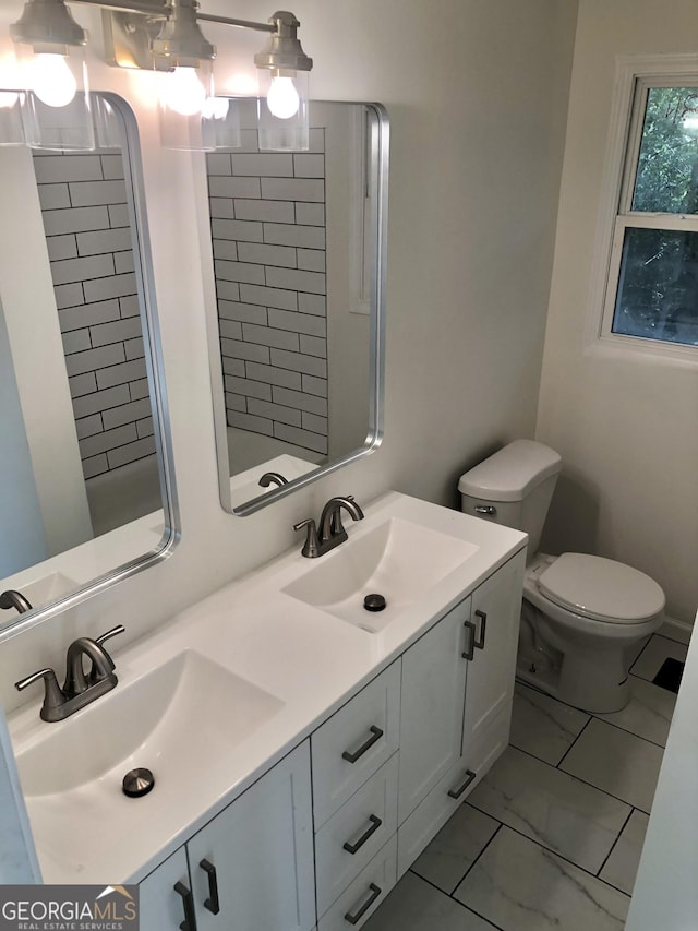 4330 Cedar Valley Ln, Conley, GA 30288 - bathroom featuring marble look tiles and double vanity