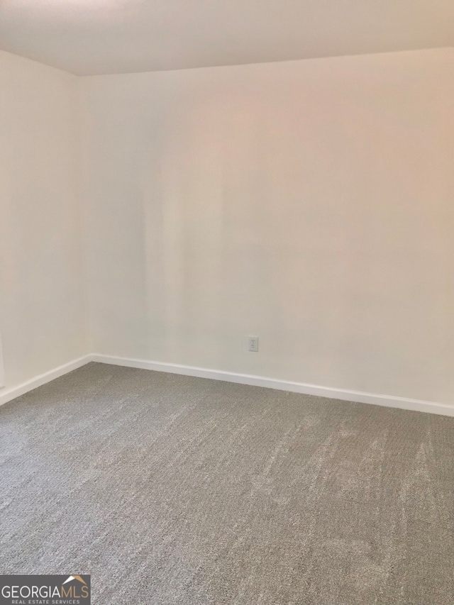 unfurnished room featuring carpet floors