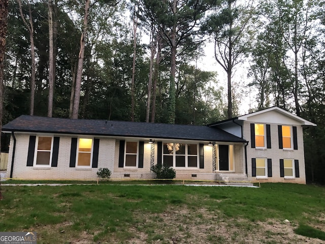 split level home with a front yard