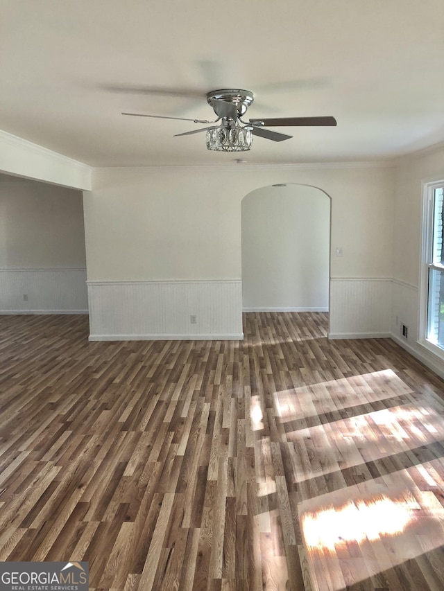 4330 Cedar Valley Ln, Conley, GA 30288 - unfurnished room featuring ceiling fan, arched walkways, wood finished floors, wainscoting, and ornamental molding
