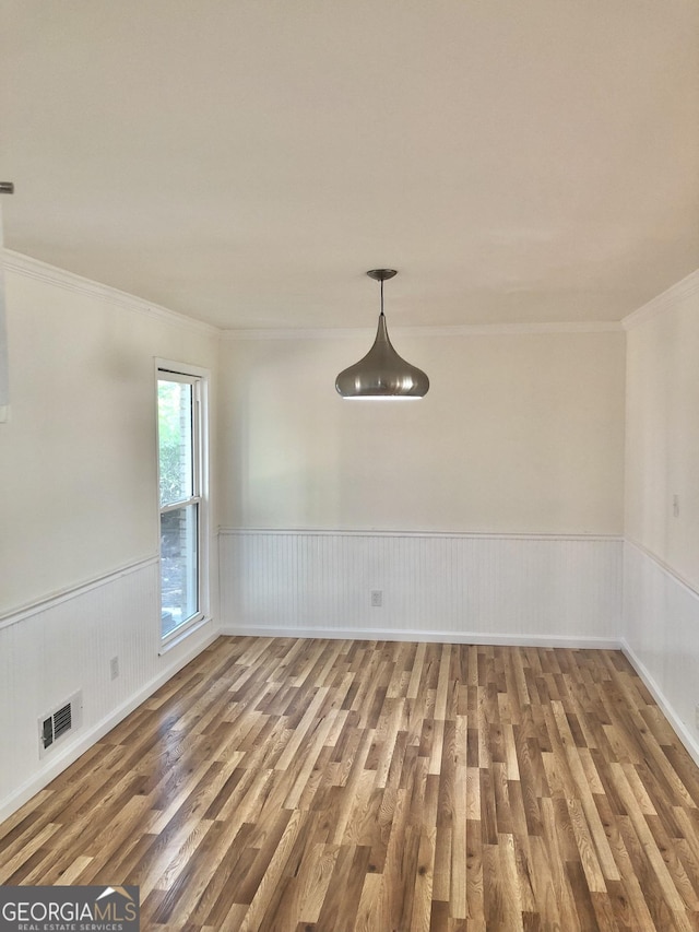 4330 Cedar Valley Ln, Conley, GA 30288 - unfurnished room with wood finished floors, ornamental molding, and a wainscoted wall