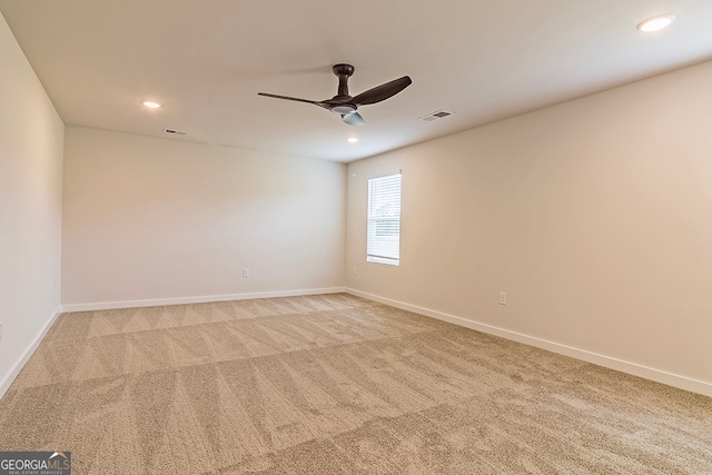 empty room featuring carpet flooring and ceiling fan