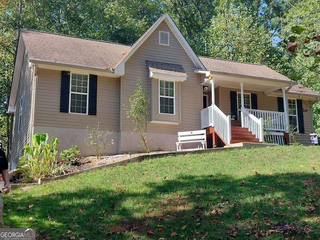 single story home featuring a porch and a front yard