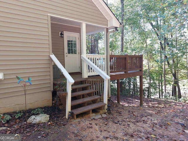 doorway to property with a wooden deck