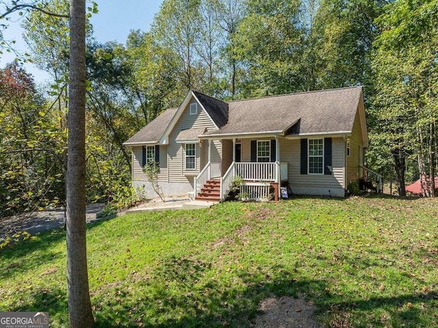 ranch-style home featuring a front yard