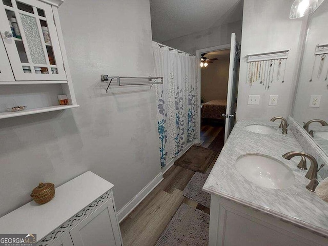 bathroom with vanity, hardwood / wood-style flooring, and ceiling fan