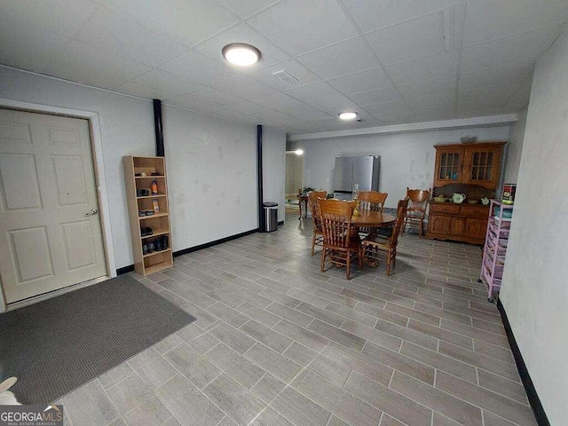 dining room with a paneled ceiling