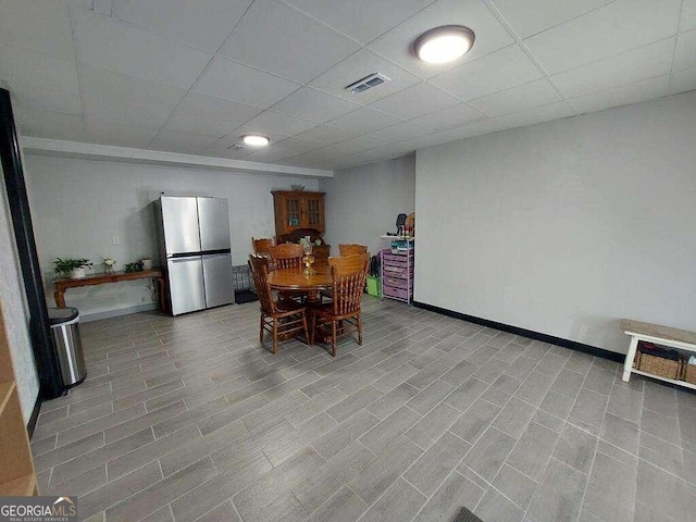 dining space featuring a paneled ceiling