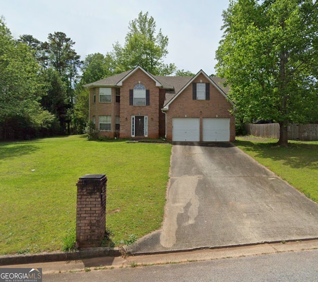 view of front of house featuring a front yard and a garage