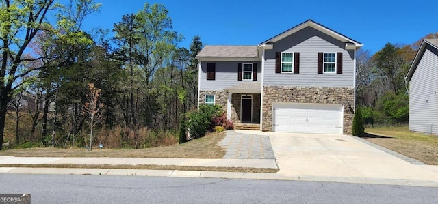 128 Embry Blvd, Pendergrass, GA 30567 - view of front of property featuring stone siding, concrete driveway, and a garage